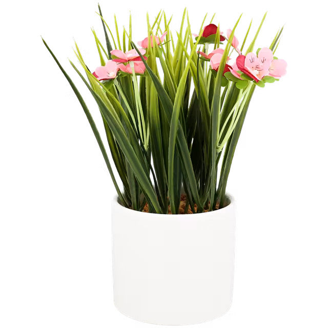 Plante artificielle rose en pot de céramique